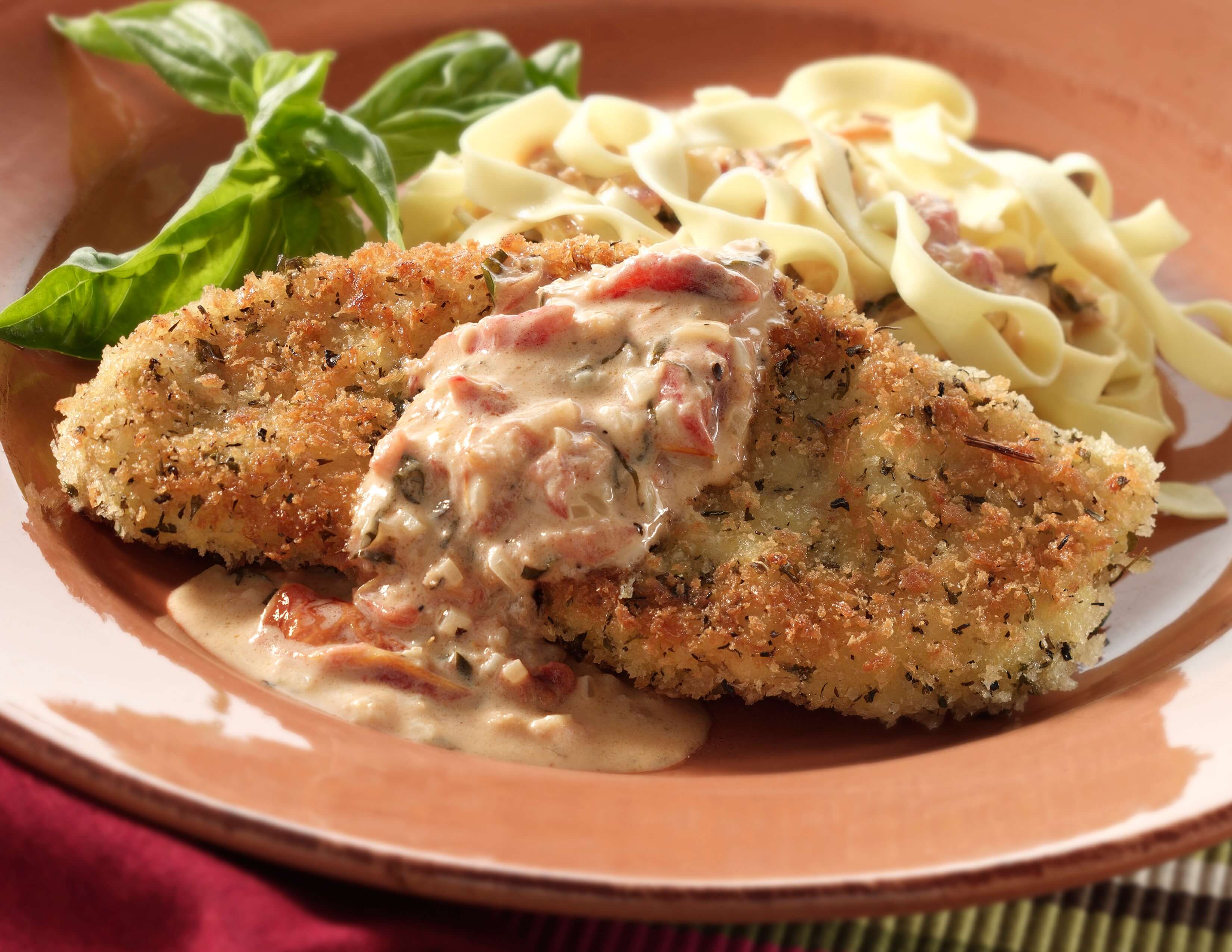 Herb Encrusted Turkey Cutlets with Tomato and Basil Cream Sauce Recipe - National Turkey Federation