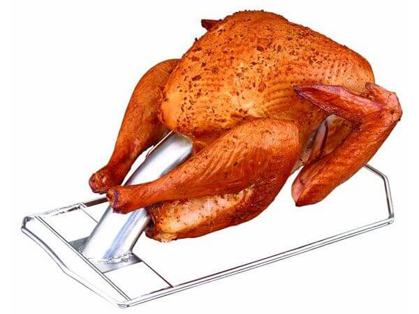 Roasted turkey positioned on a turkey cannon 