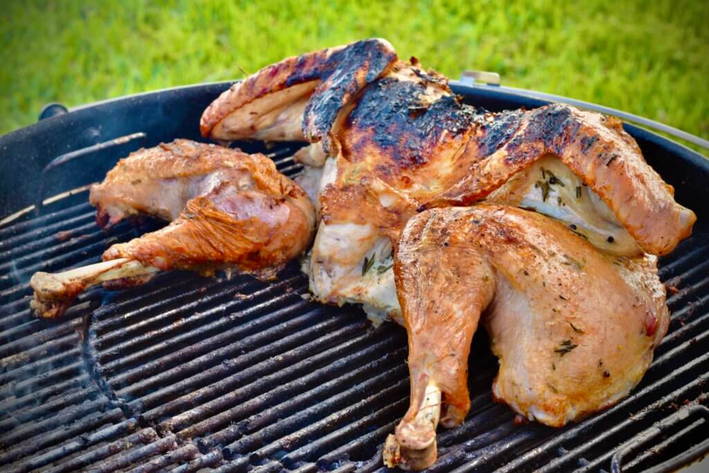 Spatchcocked turkey on a grill